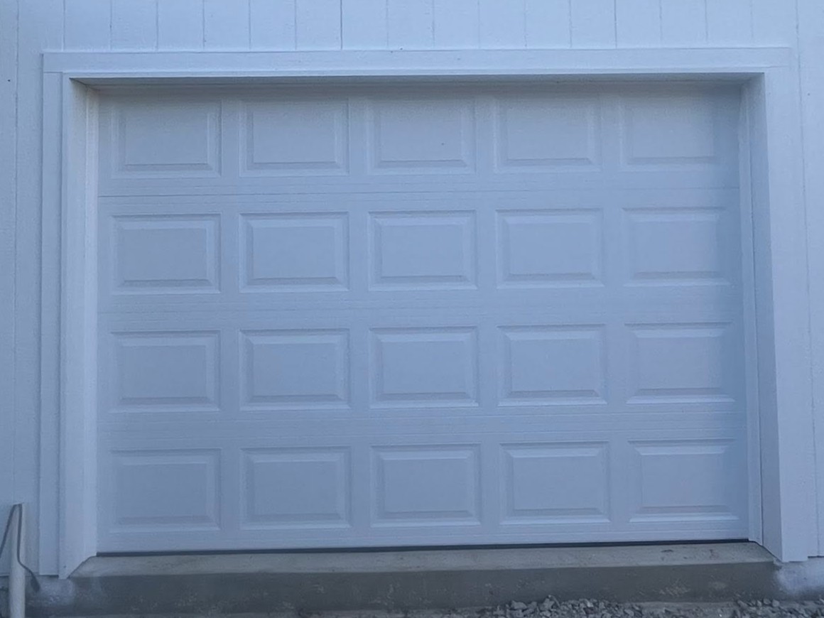 Single white garage door installation